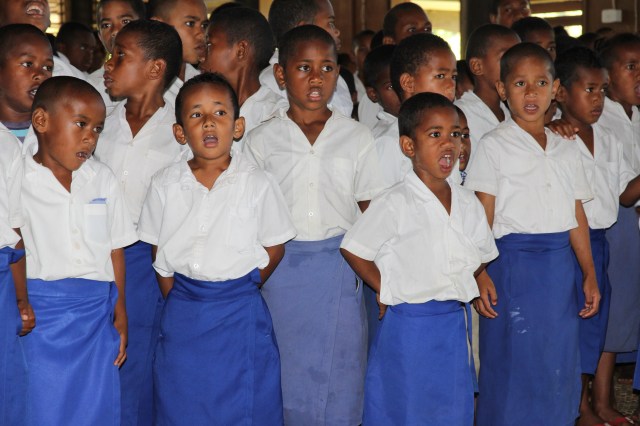 Children welcoming the team with songs