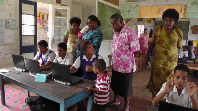 Interested parents asking their children questions at the showcase 