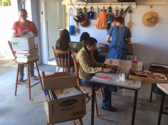 Hard working volunteers going through the library books 