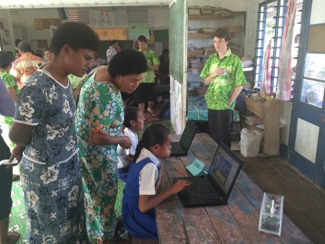 Parents and community members engaged in the students presentations.