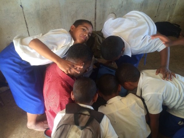 Mr Aisea and his Year 5 students using the new laptops.