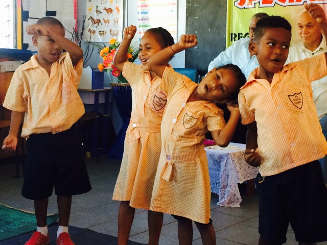 Children performing for the QUT group