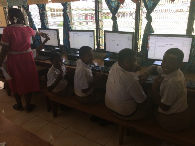 Year 7 students engaged and having fun on the computers.