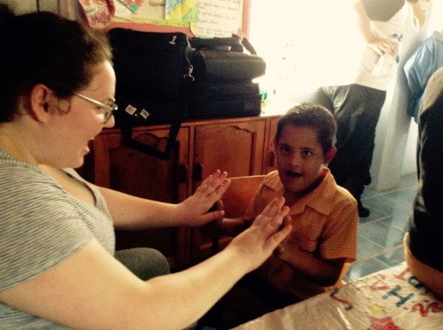 A student teahcing Katie a new game