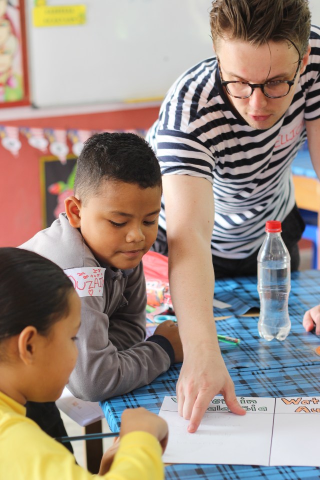 Elliott helping one of his students (Class 3)