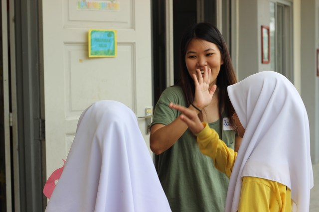 Time for a high five. Jocelyn says well done to some of her students